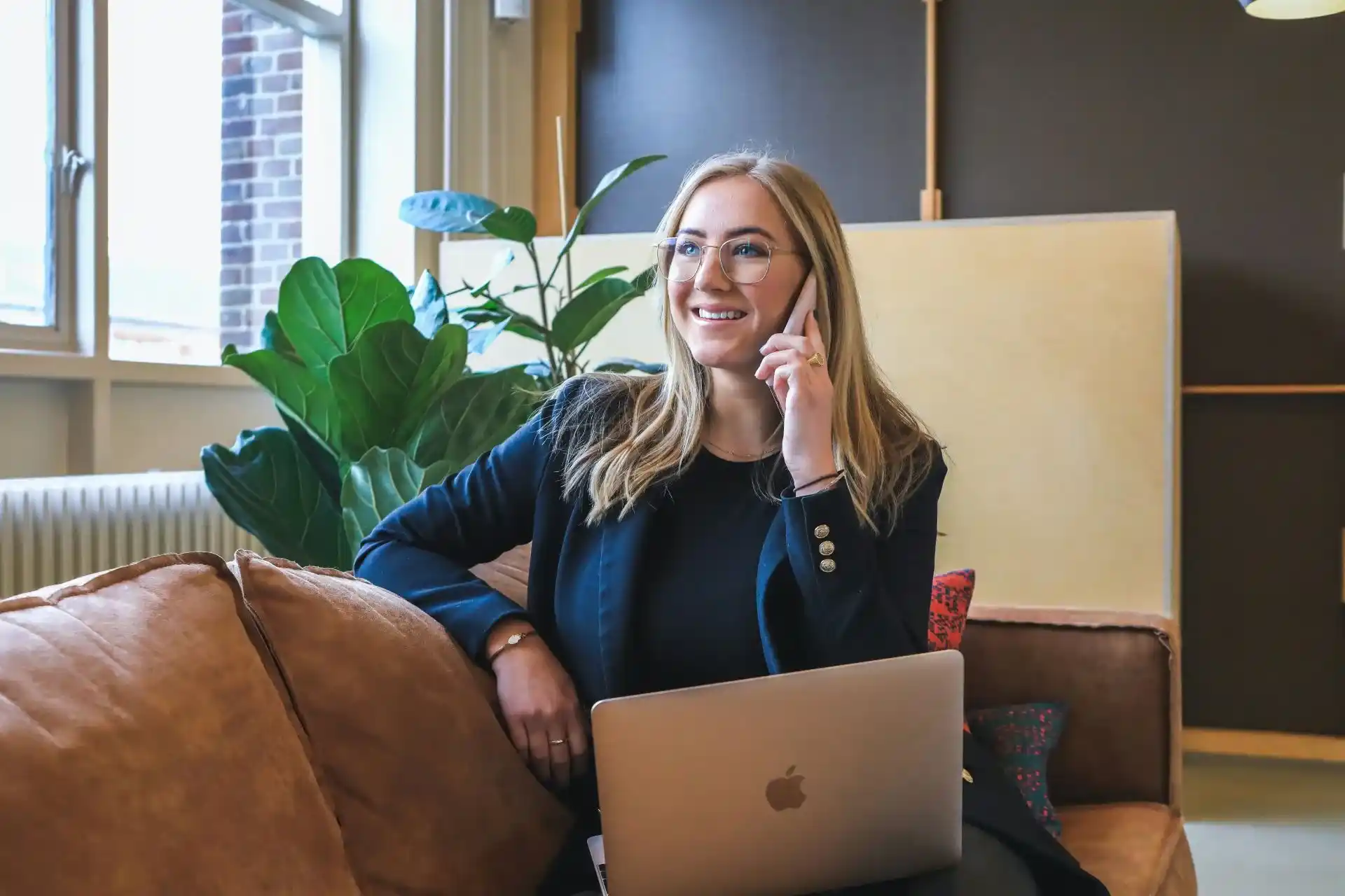 smiling business women on a call in a company office