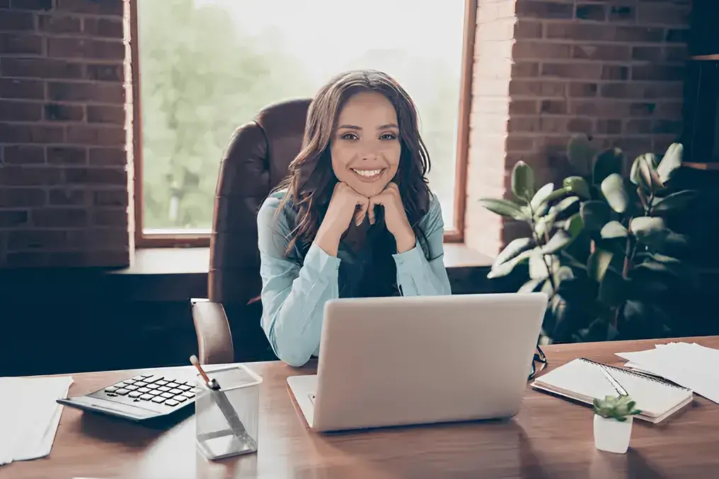 professional business woman with laptop infront of it on a working table