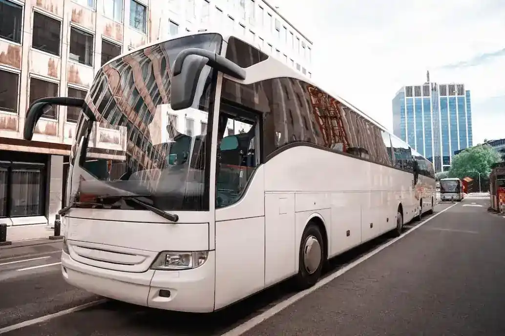 luxury bus on a road in a developed area