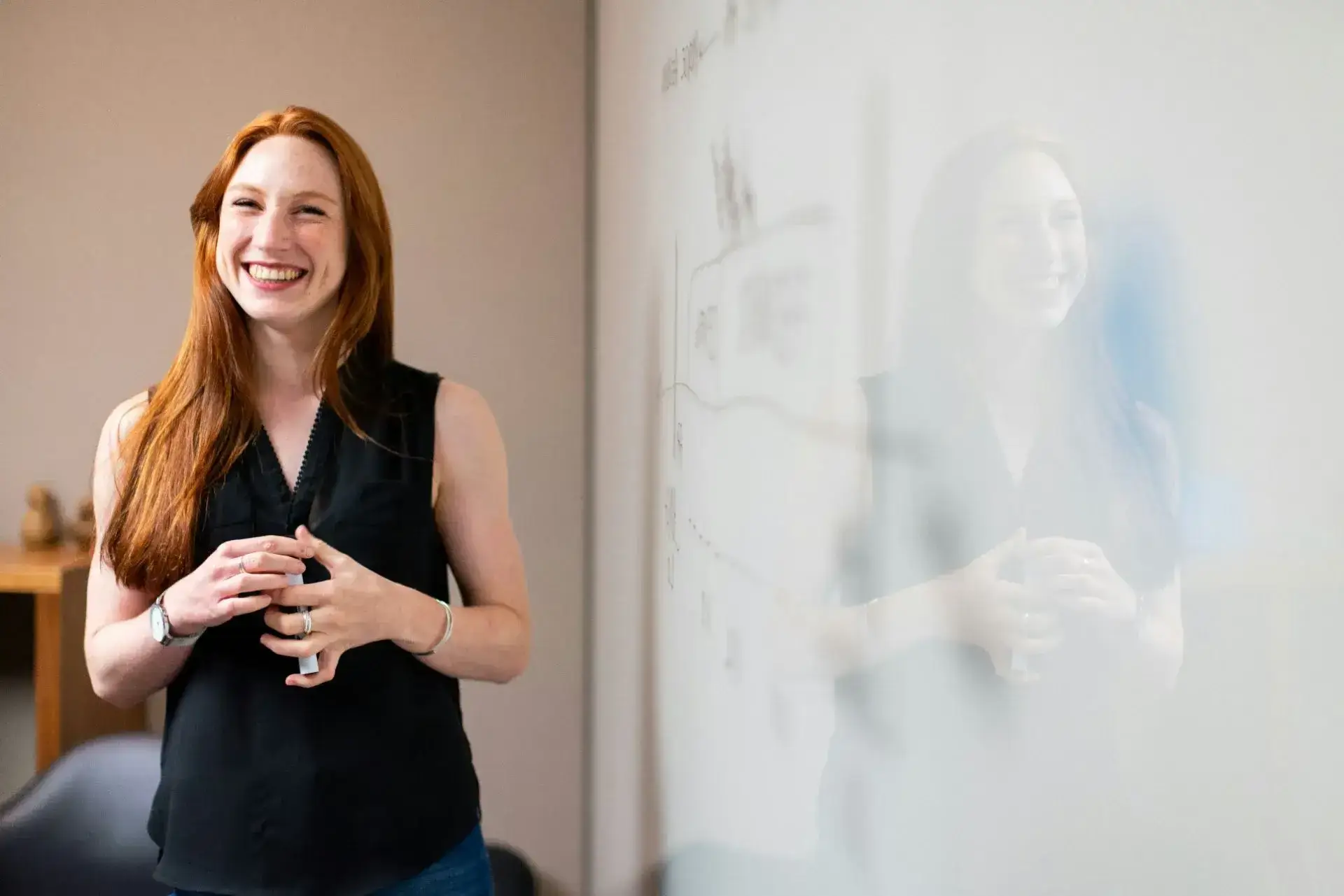 smiling young woman with a pencil in her hand